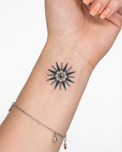 INKY Eyeburst semi-permanent tattoo applied on a woman – 2 x 2 in (4x4 cm) design, realistic ink look, lasts 10 days