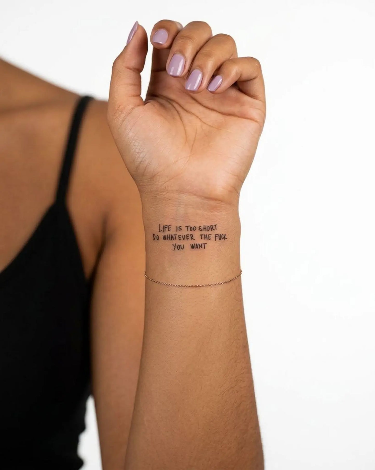 INKY Life's Short 2 semi-permanent tattoo applied on a woman – 2 x 2 in (4x4 cm) design, realistic ink look, lasts 10 days