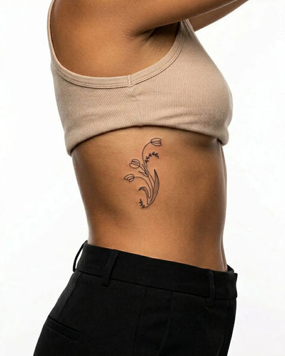 INKY Spring Buds semi-permanent tattoo applied on a woman – 2 x 4 in (6x10 cm) design, realistic ink look, lasts 10 days
