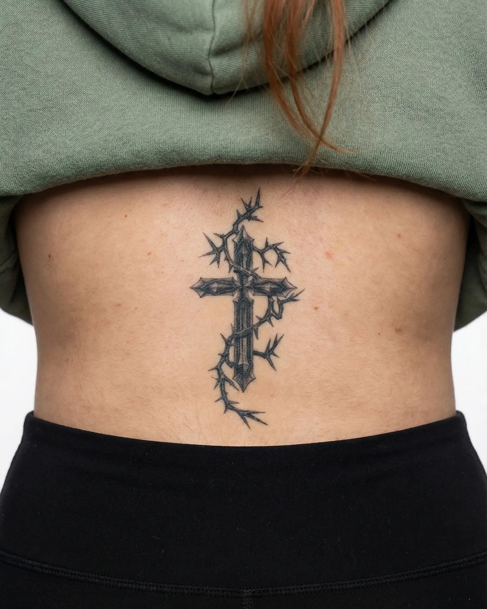 INKY Gothic Cross semi-permanent tattoo applied on a woman – 2 x 4 in (6x10 cm) design, realistic ink look, lasts 10 days