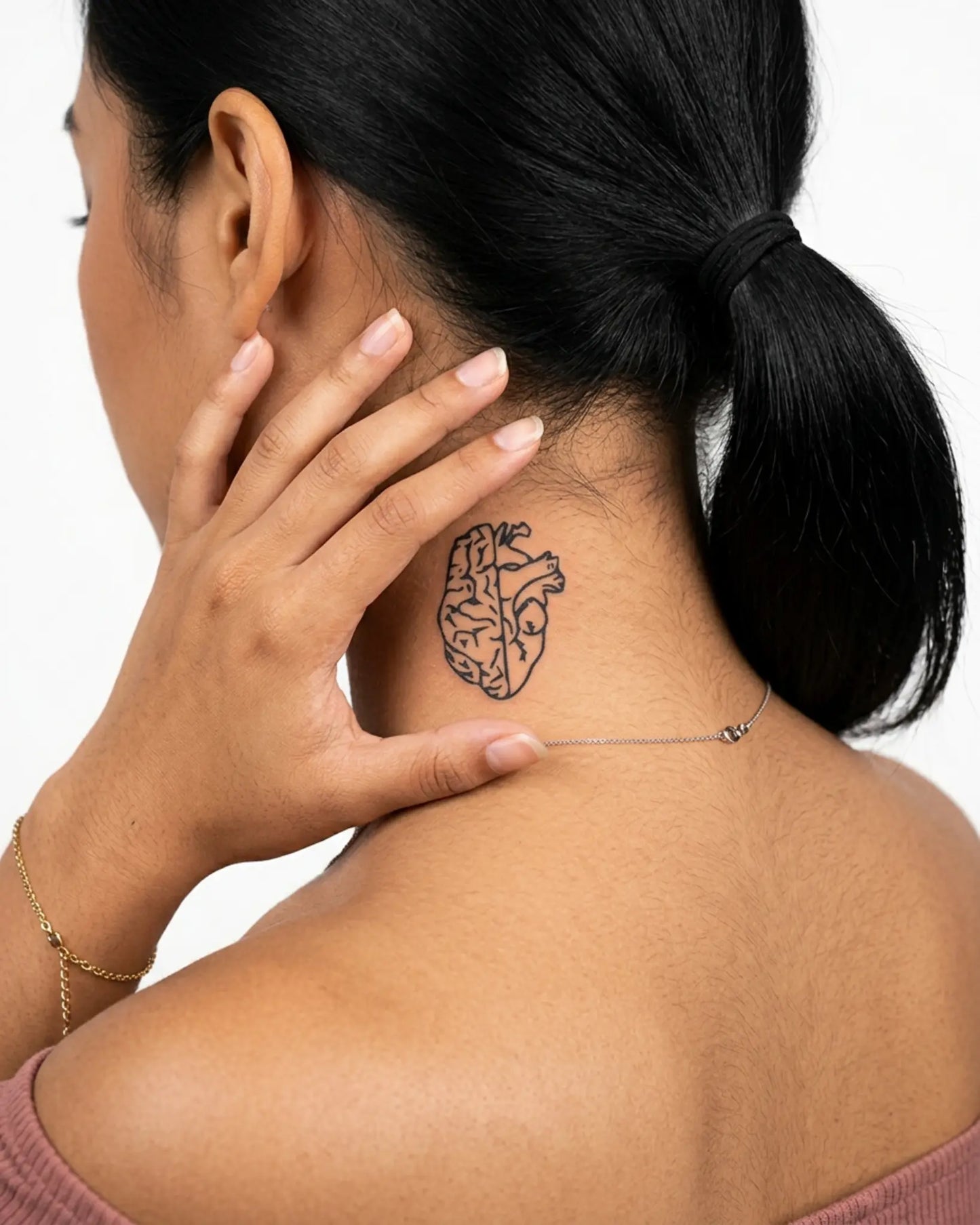 INKY Mind & Heart semi-permanent tattoo applied on a woman – 2 x 2 in (4x4 cm) design, realistic ink look, lasts 10 days