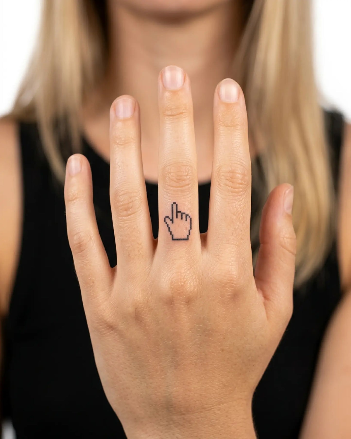 INKY Pixel Hand semi-permanent tattoo applied on a woman – 0.5 x 0.5 in (1x1 cm) design, realistic ink look, lasts 10 days