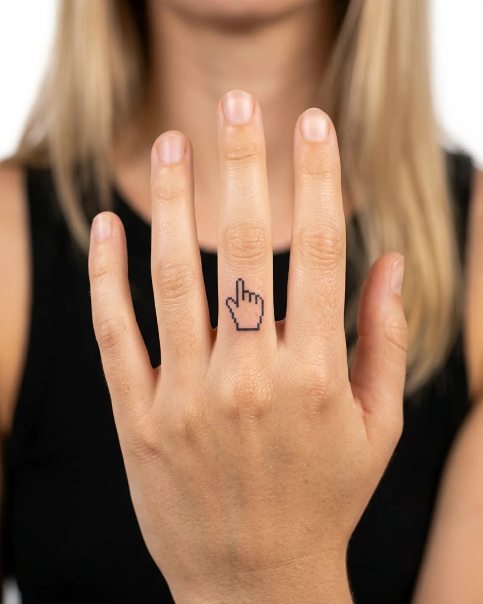 INKY Pixel Hand semi-permanent tattoo applied on a woman – 0.5 x 0.5 in (1x1 cm) design, realistic ink look, lasts 10 days