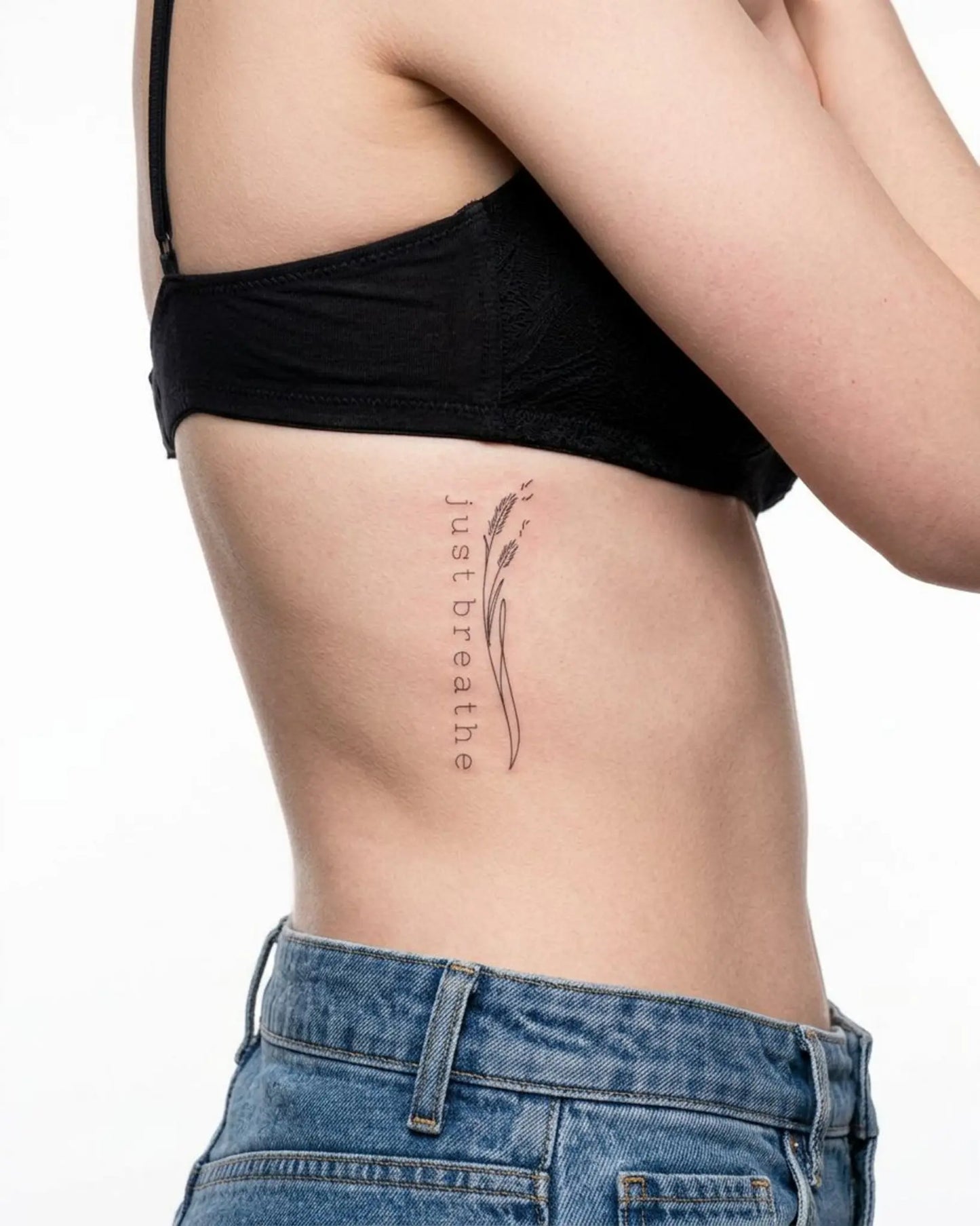 INKY Just Breathe semi-permanent tattoo applied on a woman – 2 x 4 in (6x10 cm) design, realistic ink look, lasts 10 days
