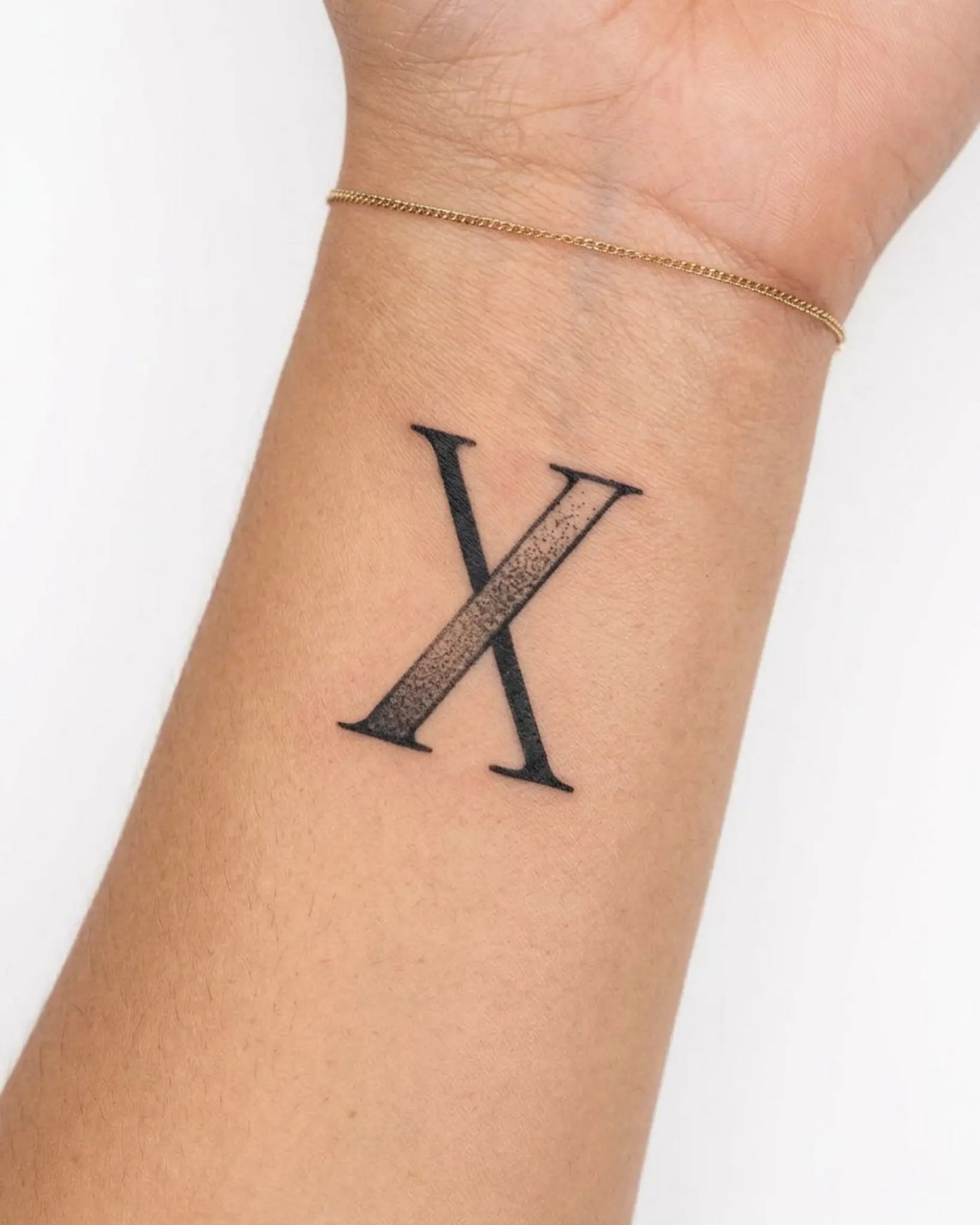 INKY Stippled 10 semi-permanent tattoo applied on a woman – 2 x 2 in (4x4 cm) design, realistic ink look, lasts 10 days