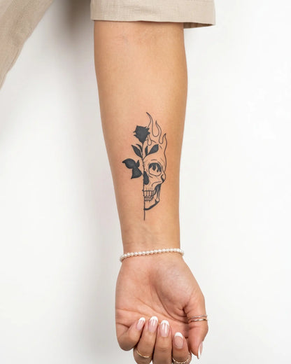 INKY Skull Bloom 3 semi-permanent tattoo applied on a woman – 2 x 4 in (6x10 cm) design, realistic ink look, lasts 10 days