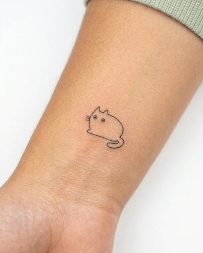 INKY Chubby Cat semi-permanent tattoo applied on a woman – 0.5 x 0.5 in (1x1 cm) design, realistic ink look, lasts 10 days
