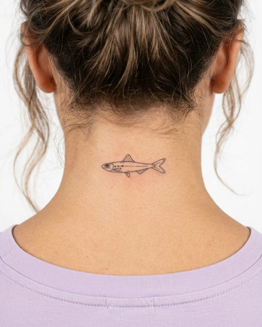 INKY Little Fish 2 semi-permanent tattoo applied on a woman – 2 x 2 in (4x4 cm) design, realistic ink look, lasts 10 days