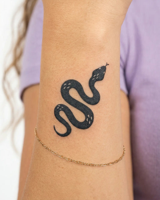INKY Dark Serpent semi-permanent tattoo applied on a woman – 2 x 2 in (4x4 cm) design, realistic ink look, lasts 10 days