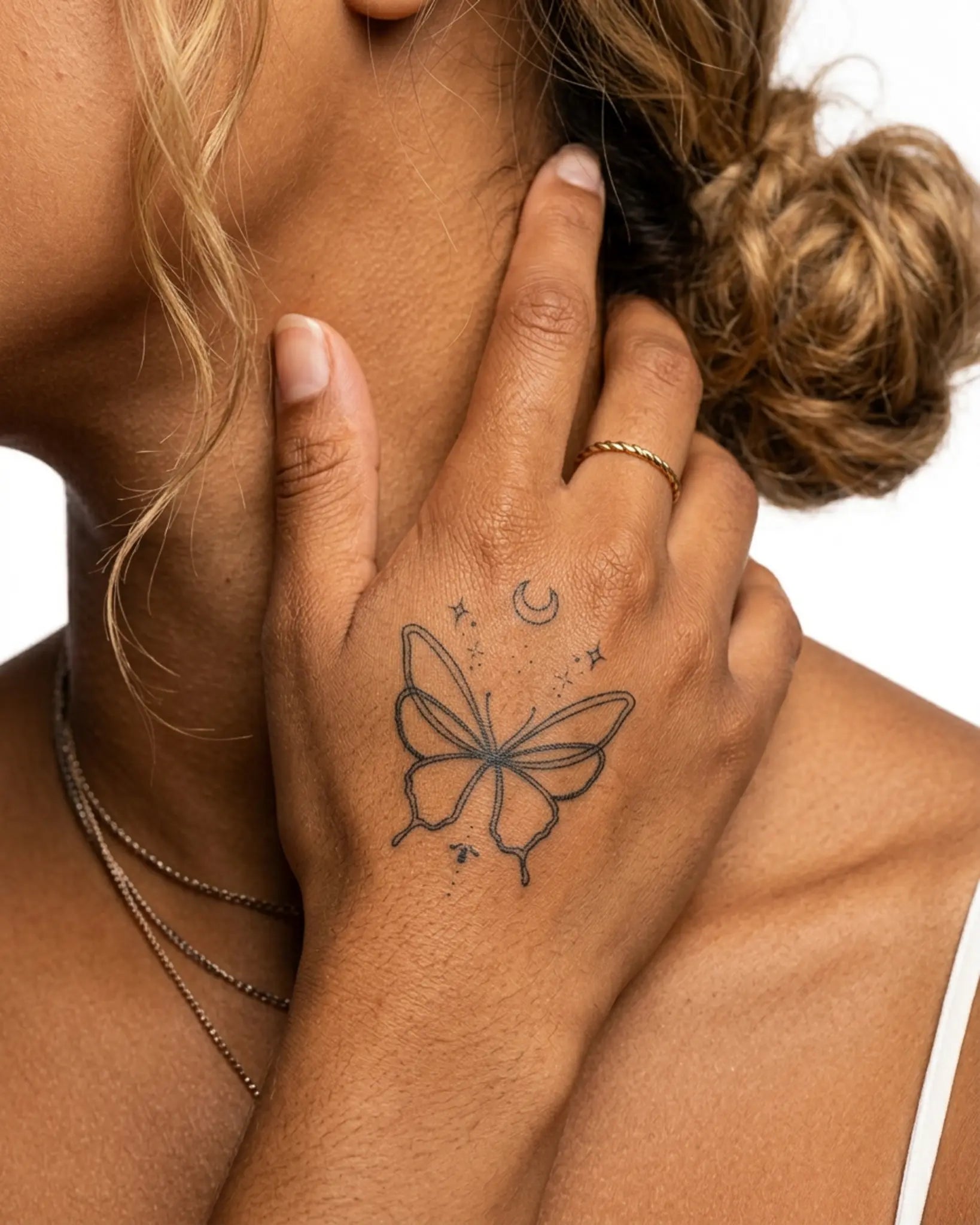 INKY Star Butterfl semi-permanent tattoo applied on a woman – 2 x 2 in (4x4 cm) design, realistic ink look, lasts 10 days