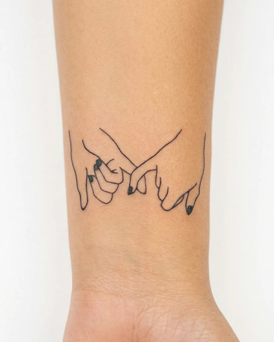 INKY Pinky Promise 2 semi-permanent tattoo applied on a woman – 2 x 2 in (4x4 cm) design, realistic ink look, lasts 10 days