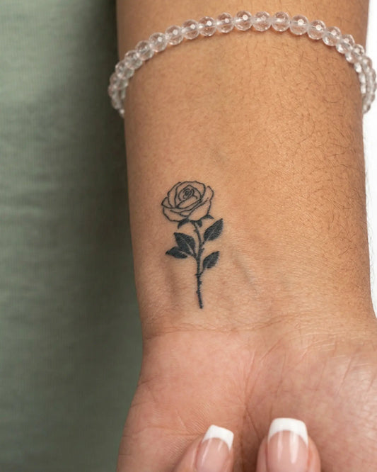 INKY Black Rose semi-permanent tattoo applied on a woman – 2 x 2 in (4x4 cm) design, realistic ink look, lasts 10 days
