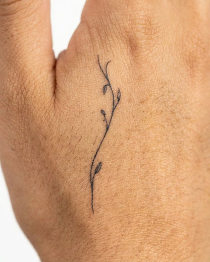 INKY Slim Vine semi-permanent tattoo applied on a woman – 2 x 2 in (4x4 cm) design, realistic ink look, lasts 10 days