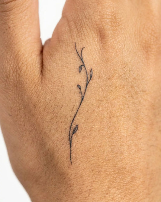 INKY Slim Vine semi-permanent tattoo applied on a woman – 2 x 2 in (4x4 cm) design, realistic ink look, lasts 10 days