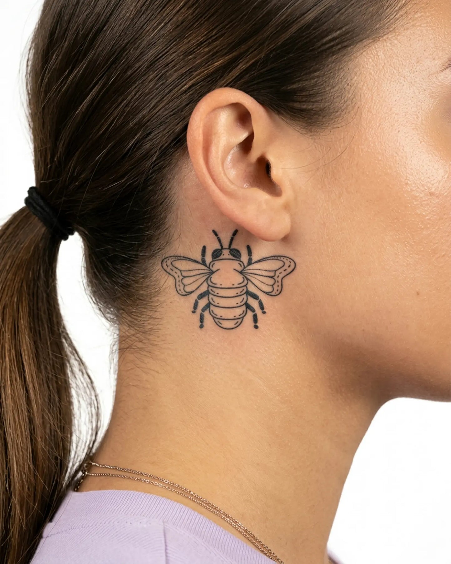 INKY Buzz Bee semi-permanent tattoo applied on a woman – 2 x 2 in (4x4 cm) design, realistic ink look, lasts 10 days