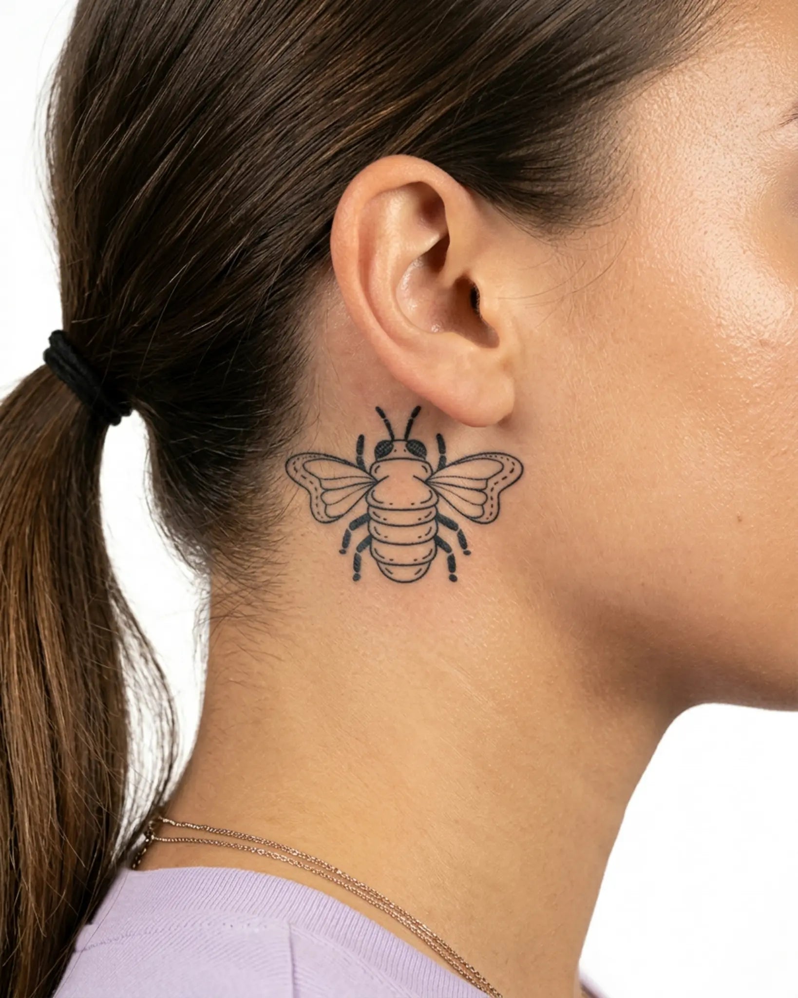 INKY Buzz Bee semi-permanent tattoo applied on a woman – 2 x 2 in (4x4 cm) design, realistic ink look, lasts 10 days