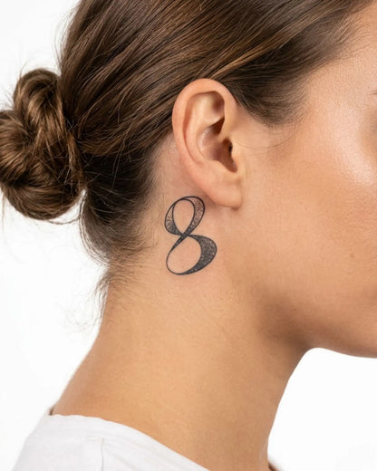 INKY Infinity 8 2 semi-permanent tattoo applied on a woman – 2 x 2 in (4x4 cm) design, realistic ink look, lasts 10 days