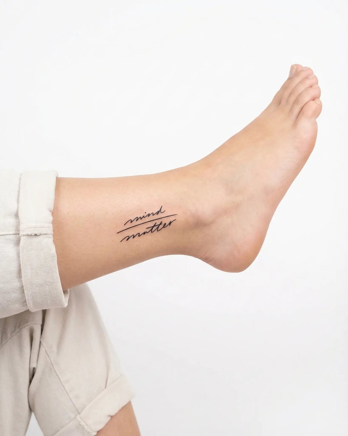 INKY Mind Matter semi-permanent tattoo applied on a woman – 2 x 2 in (4x4 cm) design, realistic ink look, lasts 10 days