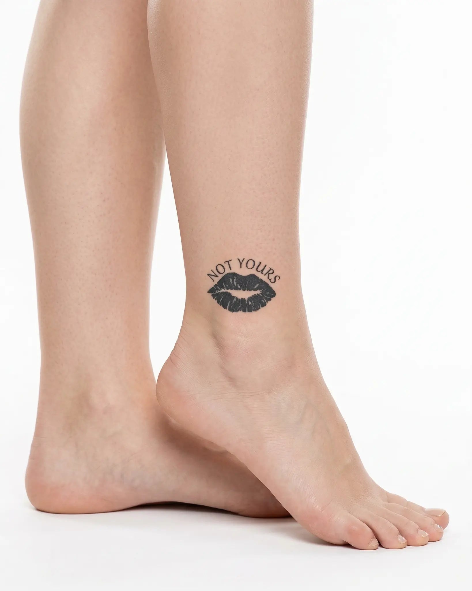 INKY Not Yours semi-permanent tattoo applied on a woman – 2 x 2 in (4x4 cm) design, realistic ink look, lasts 10 days