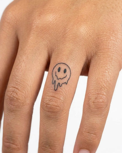 INKY Drippy Smile semi-permanent tattoo applied on a woman – 0.5 x 0.5 in (1x1 cm) design, realistic ink look, lasts 10 days