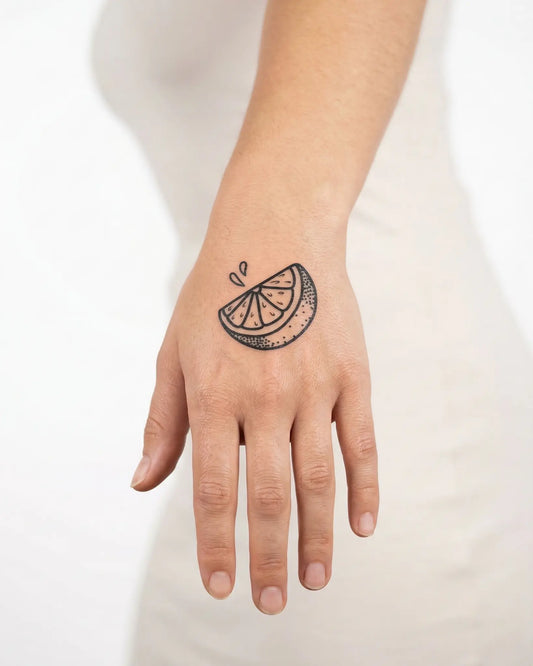 INKY Lemon Zest semi-permanent tattoo applied on a woman – 2 x 2 in (4x4 cm) design, realistic ink look, lasts 10 days