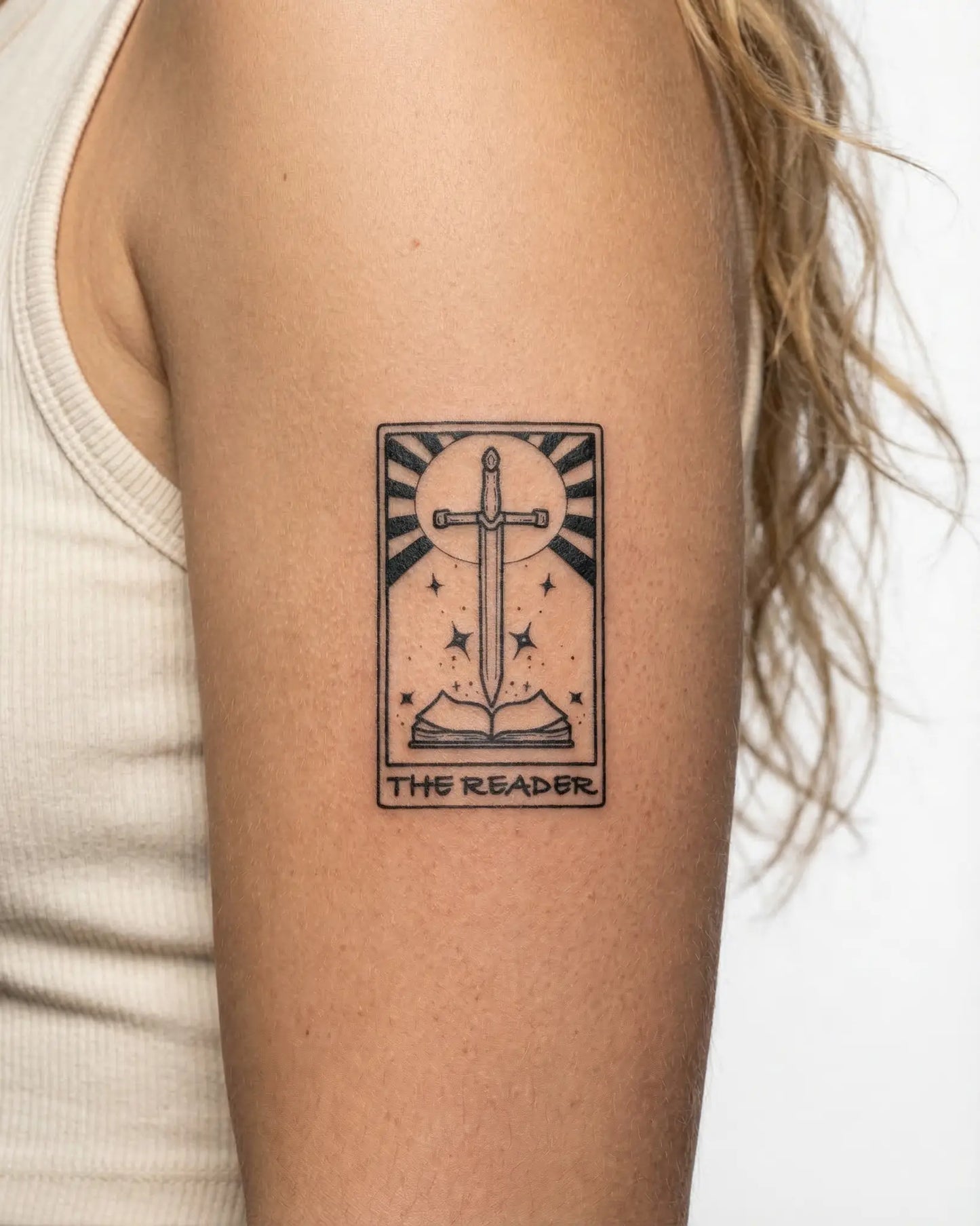 INKY The Reader semi-permanent tattoo applied on a woman – 2 x 4 in (6x10 cm) design, realistic ink look, lasts 10 days