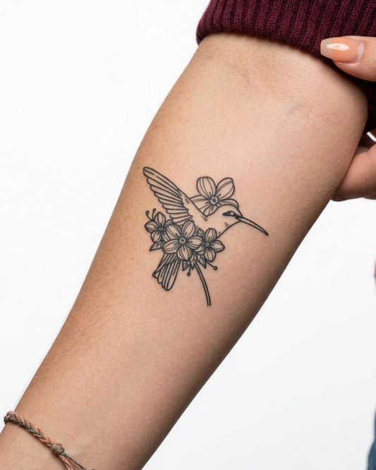 INKY Humming Bloom semi-permanent tattoo applied on a woman – 3 x 3 in (7x7 cm) design, realistic ink look, lasts 10 days