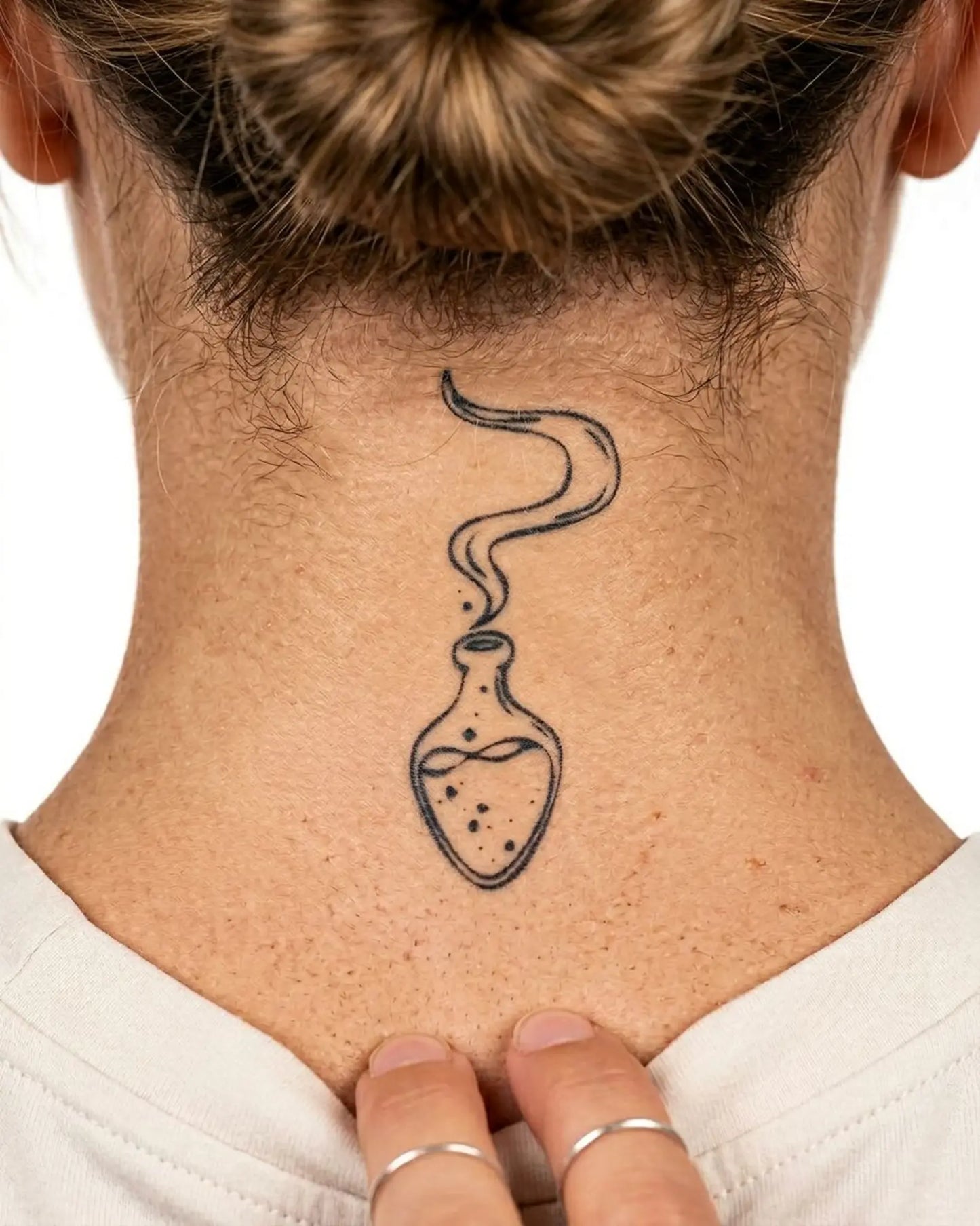 INKY Magic Potion semi-permanent tattoo applied on a woman – 2 x 2 in (4x4 cm) design, realistic ink look, lasts 10 days