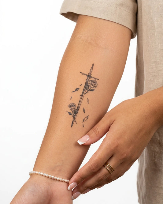 INKY Rose Sword semi-permanent tattoo applied on a woman – 2 x 4 in (6x10 cm) design, realistic ink look, lasts 10 days