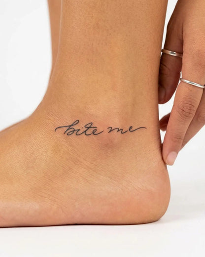 INKY Bite Me semi-permanent tattoo applied on a woman – 2 x 2 in (4x4 cm) design, realistic ink look, lasts 10 days