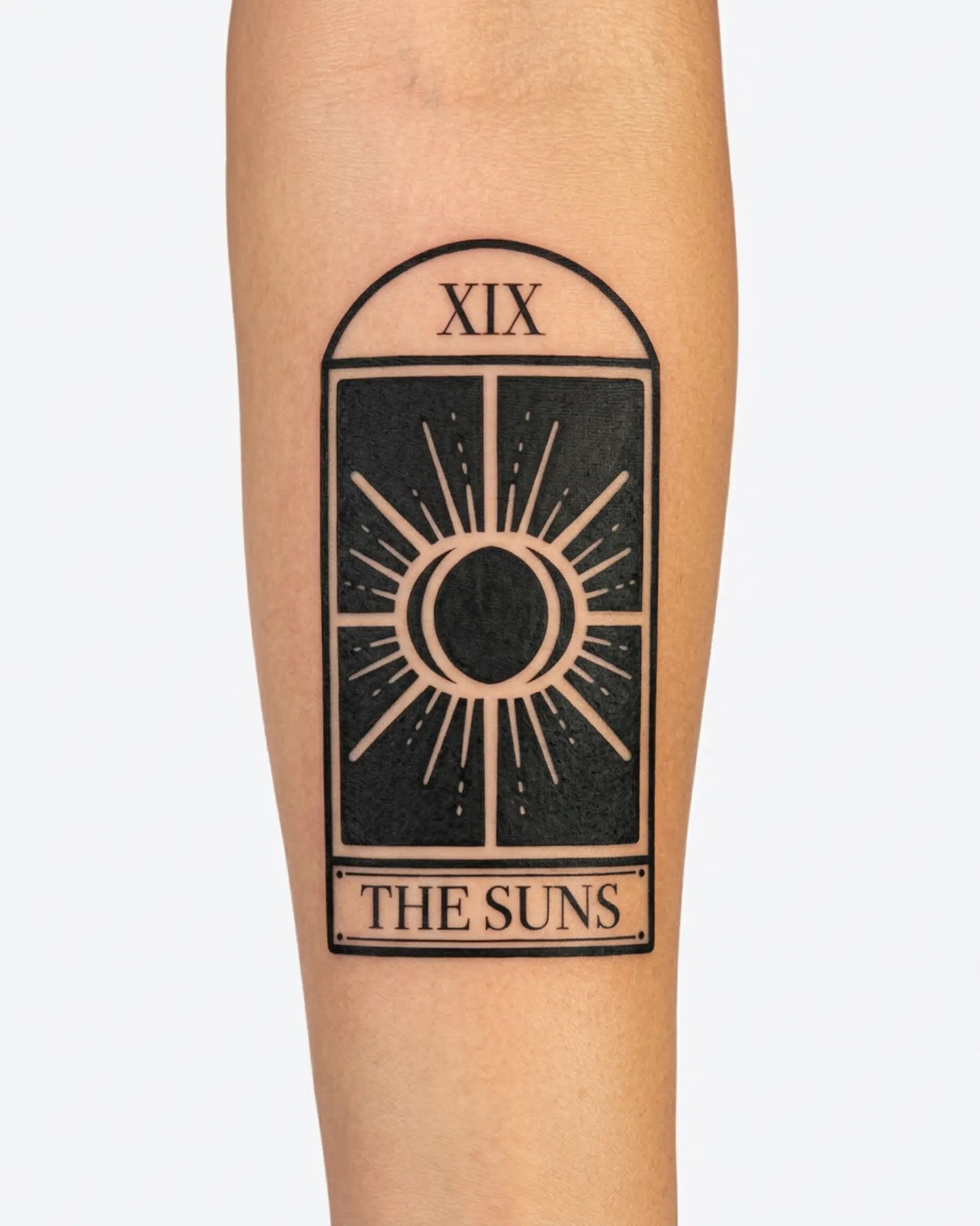 INKY Tarot Suns semi-permanent tattoo applied on a woman – 2 x 4 in (6x10 cm) design, realistic ink look, lasts 10 days