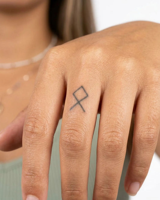 INKY Othala Rune semi-permanent tattoo applied on a woman – 0.5 x 0.5 in (1x1 cm) design, realistic ink look, lasts 10 days