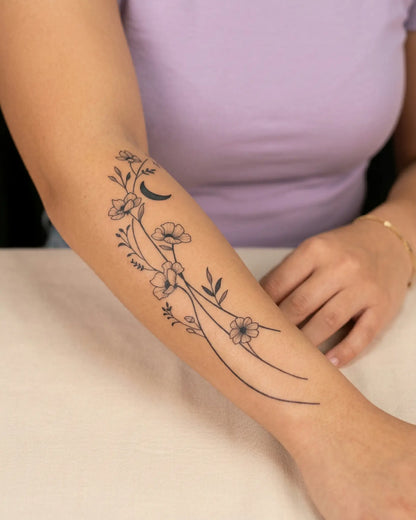 INKY Moon Bloom 2 semi-permanent tattoo applied on a woman – 4 x 7 in (10x17 cm) design, realistic ink look, lasts 10 days