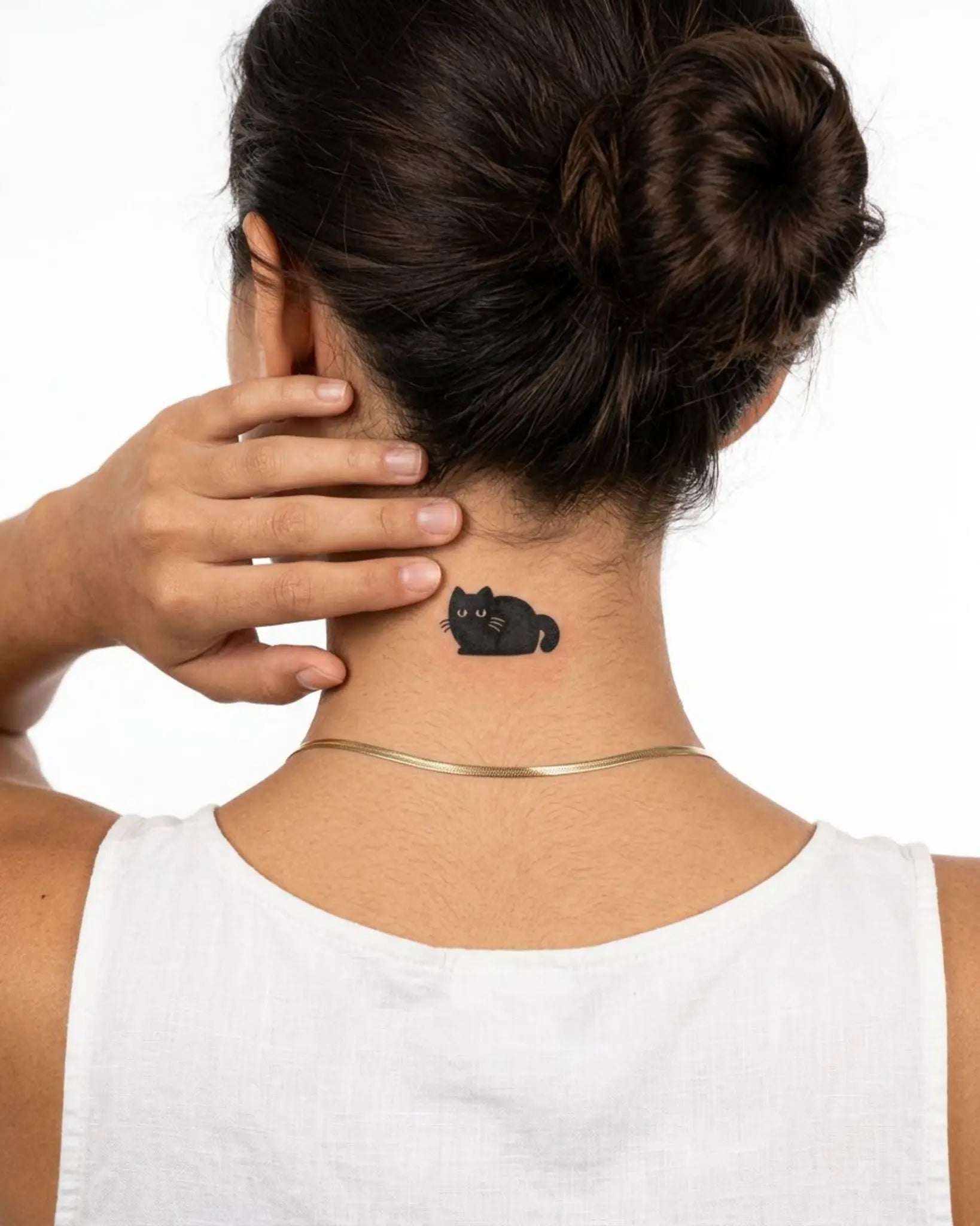 INKY Chonky Cat 2 semi-permanent tattoo applied on a woman – 2 x 2 in (4x4 cm) design, realistic ink look, lasts 10 days