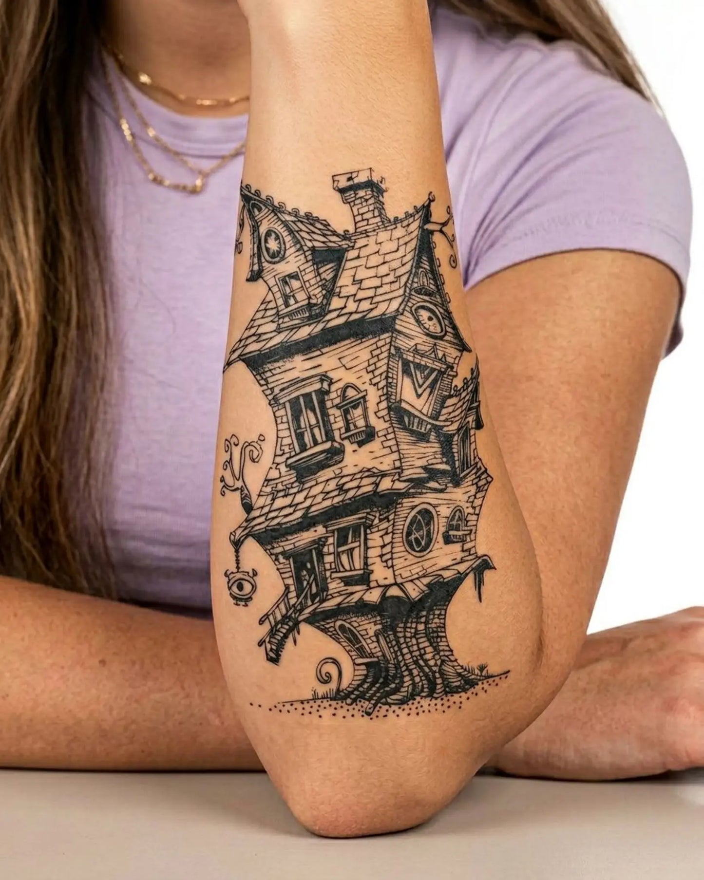 INKY Crooked Abode semi-permanent tattoo applied on a woman – 4 x 7 in (10x17 cm) design, realistic ink look, lasts 10 days