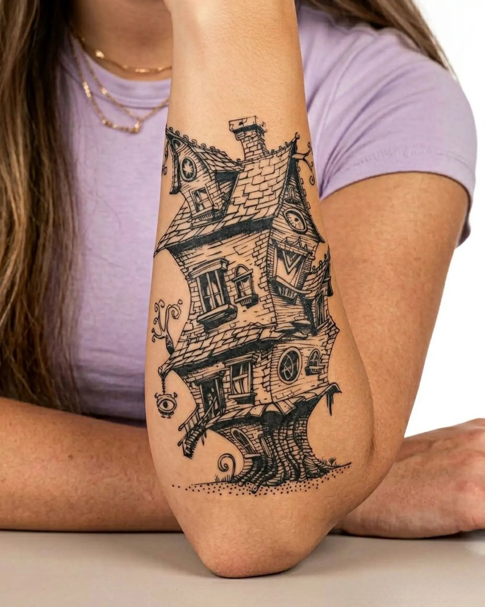INKY Crooked Abode semi-permanent tattoo applied on a woman – 4 x 7 in (10x17 cm) design, realistic ink look, lasts 10 days