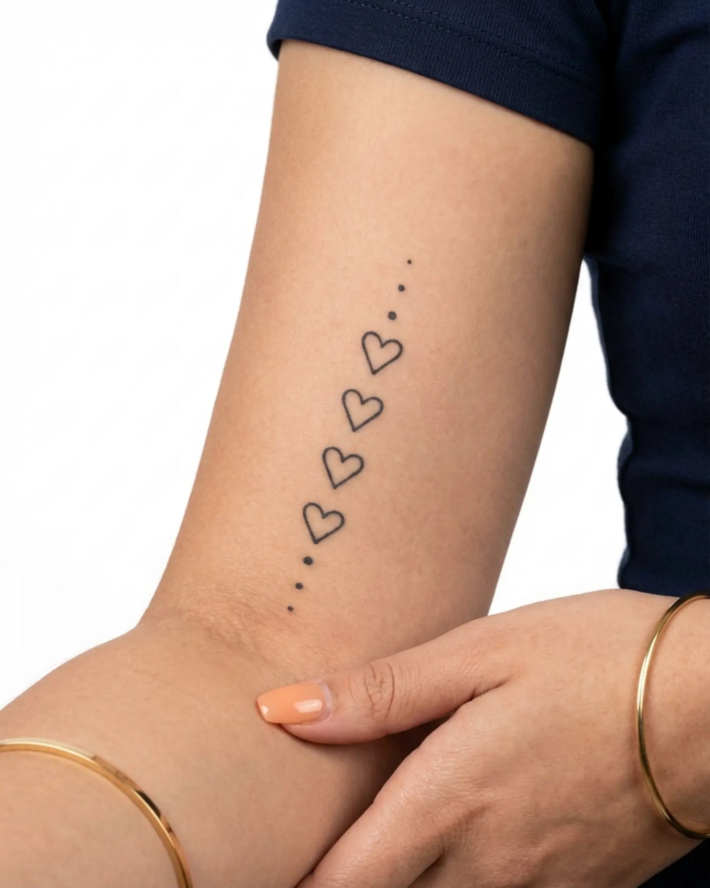 INKY Heart Chain semi-permanent tattoo applied on a woman – 2 x 4 in (6x10 cm) design, realistic ink look, lasts 10 days