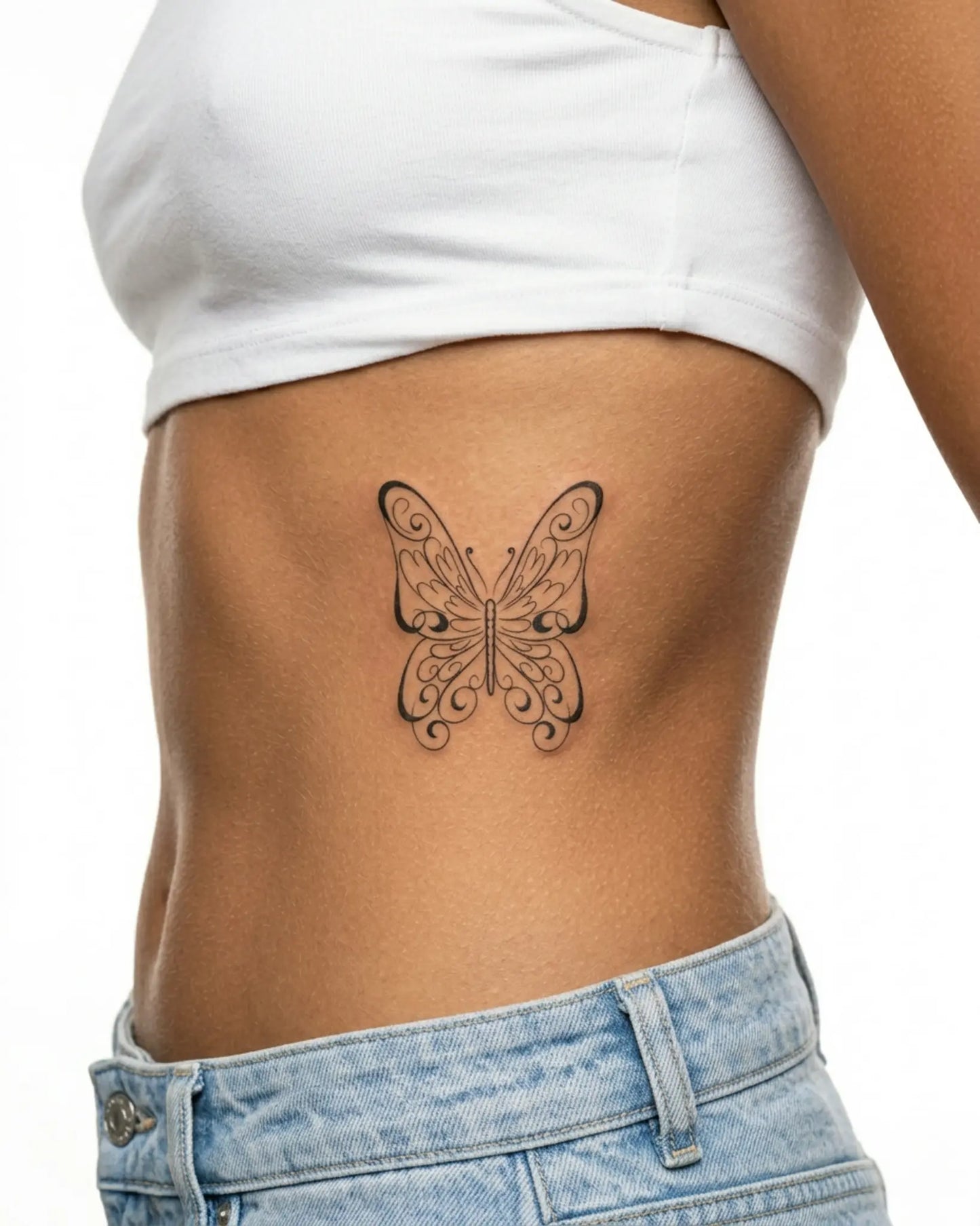 INKY Swirl Butterf 2 semi-permanent tattoo applied on a woman – 3 x 3 in (7x7 cm) design, realistic ink look, lasts 10 days
