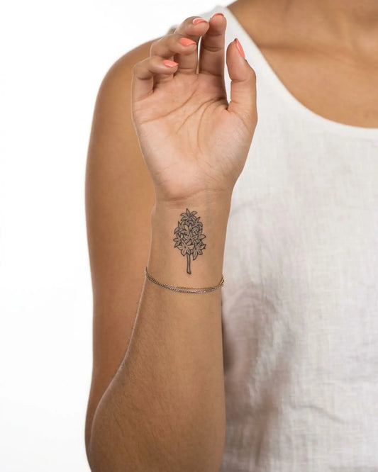 INKY Hyacinth semi-permanent tattoo applied on a woman – 2 x 2 in (4x4 cm) design, realistic ink look, lasts 10 days
