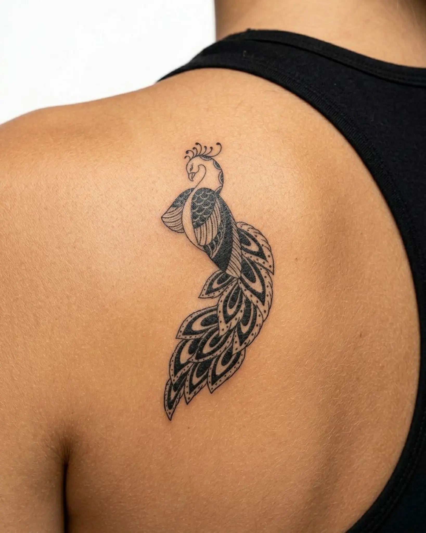 INKY Zen Peacock semi-permanent tattoo applied on a woman – 2 x 4 in (6x10 cm) design, realistic ink look, lasts 10 days