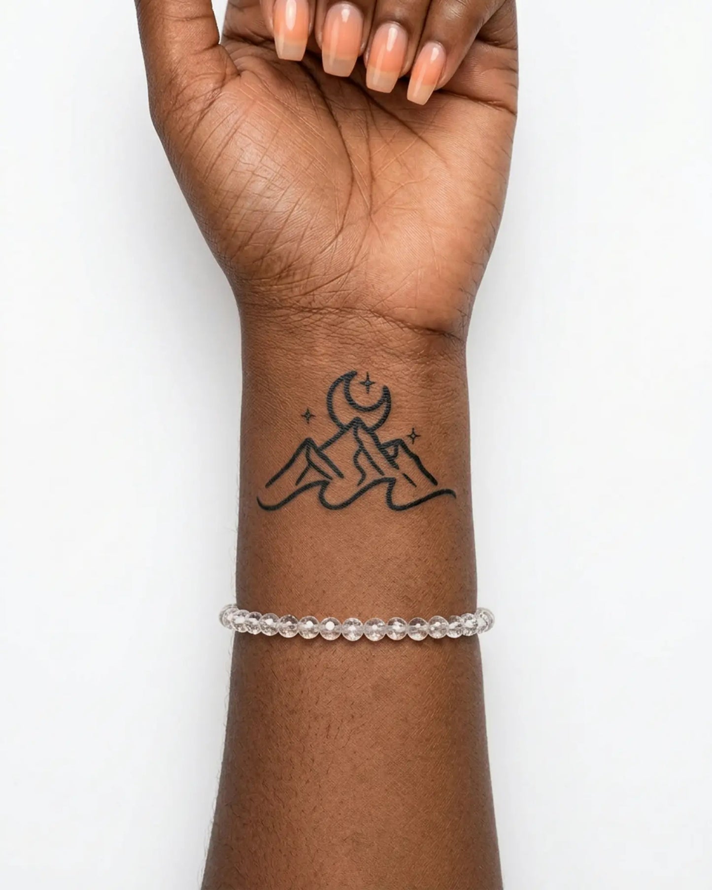 INKY Nightscape semi-permanent tattoo applied on a woman – 2 x 2 in (4x4 cm) design, realistic ink look, lasts 10 days