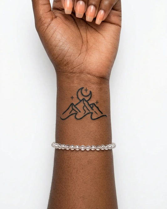 INKY Nightscape semi-permanent tattoo applied on a woman – 2 x 2 in (4x4 cm) design, realistic ink look, lasts 10 days