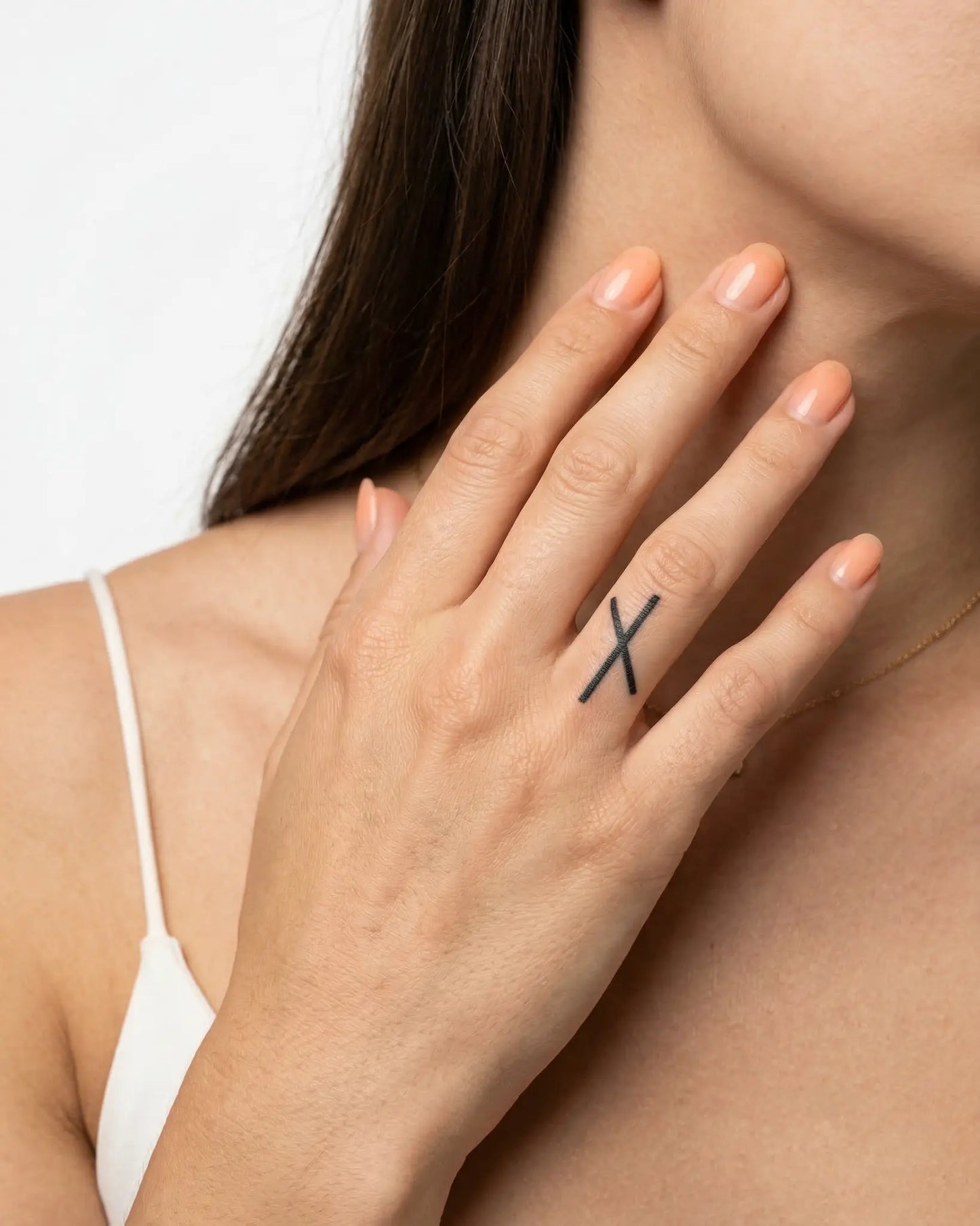 INKY Rune Symbol semi-permanent tattoo applied on a woman – 0.5 x 0.5 in (1x1 cm) design, realistic ink look, lasts 10 days