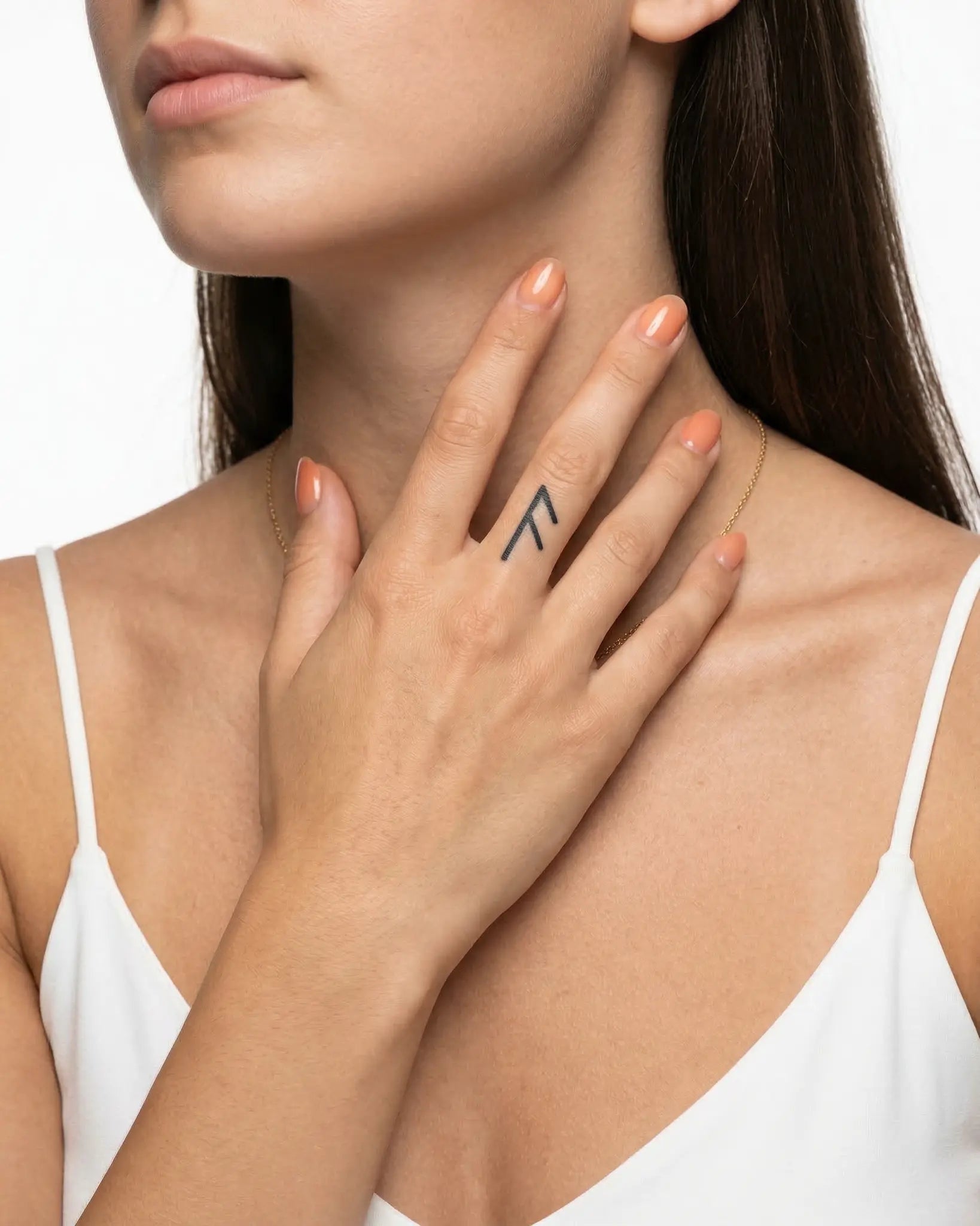 INKY Fehu Rune 2 semi-permanent tattoo applied on a woman – 0.5 x 0.5 in (1x1 cm) design, realistic ink look, lasts 10 days