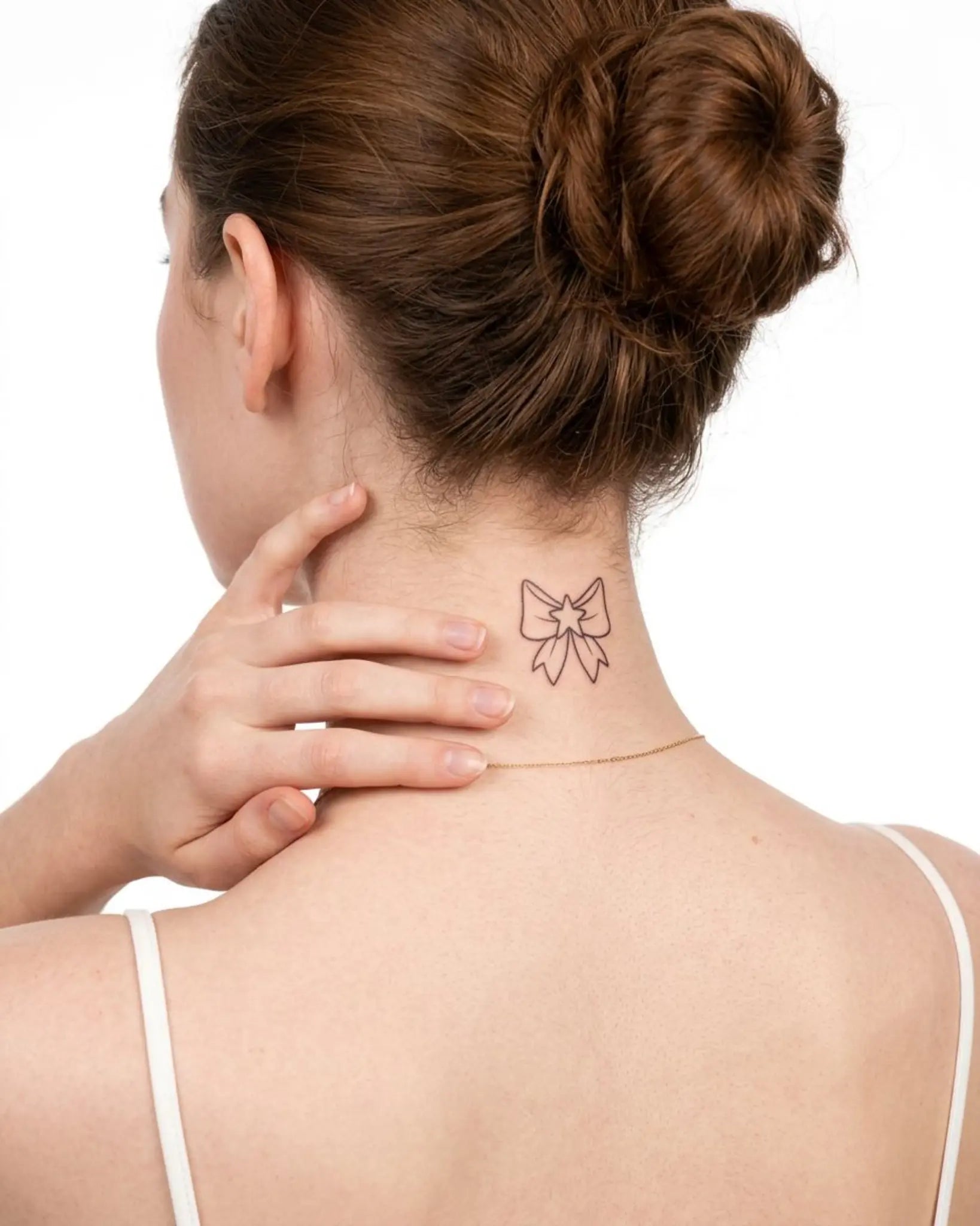 INKY Star Bow semi-permanent tattoo applied on a woman – 2 x 2 in (4x4 cm) design, realistic ink look, lasts 10 days