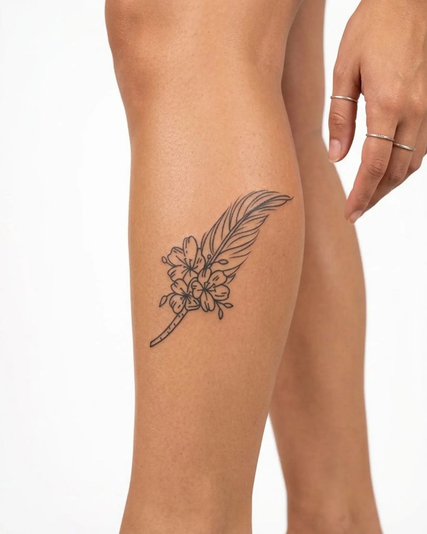 INKY Feather & Flo 2 semi-permanent tattoo applied on a woman – 2 x 4 in (6x10 cm) design, realistic ink look, lasts 10 days