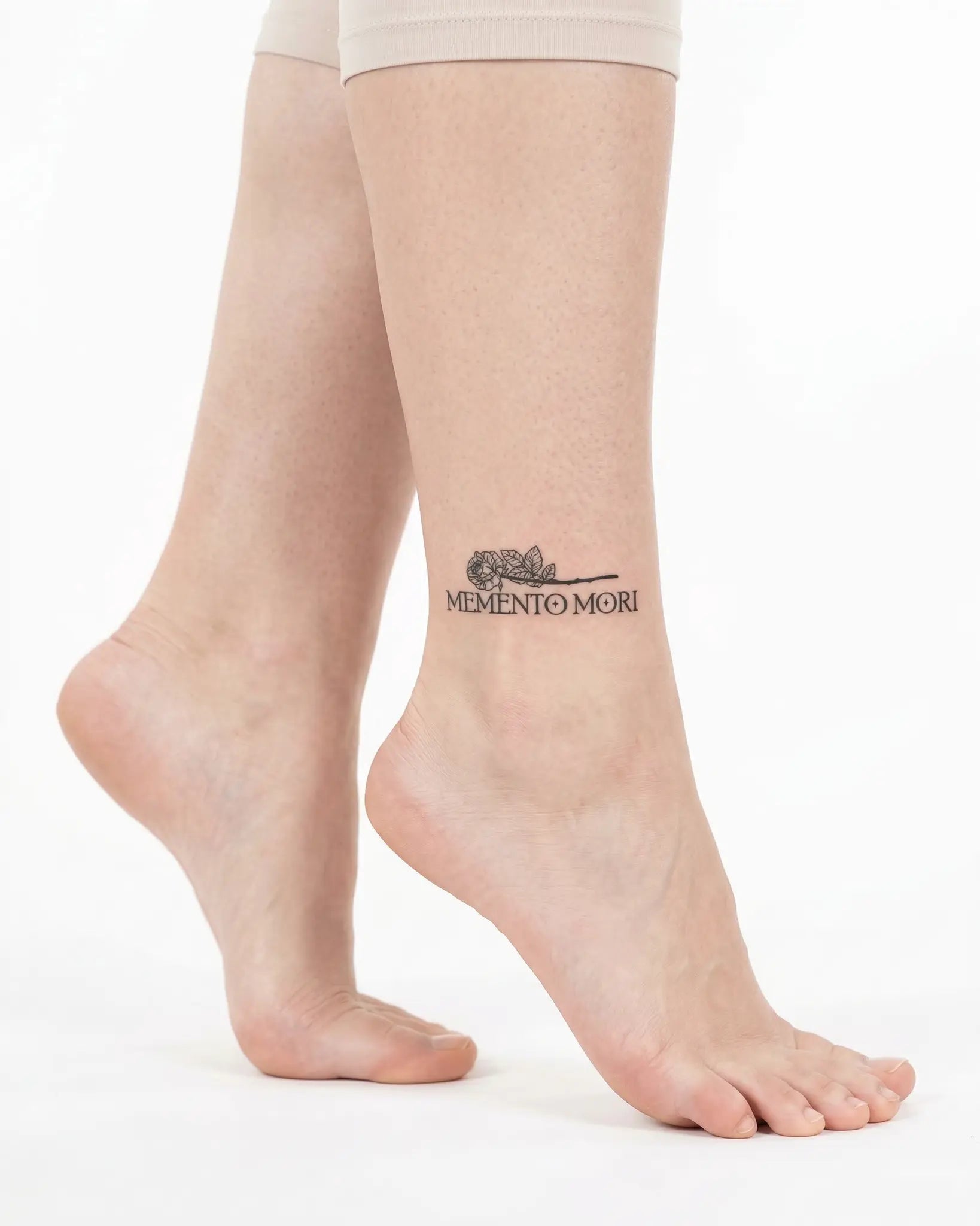 INKY Memento Mori semi-permanent tattoo applied on a woman – 2 x 2 in (4x4 cm) design, realistic ink look, lasts 10 days