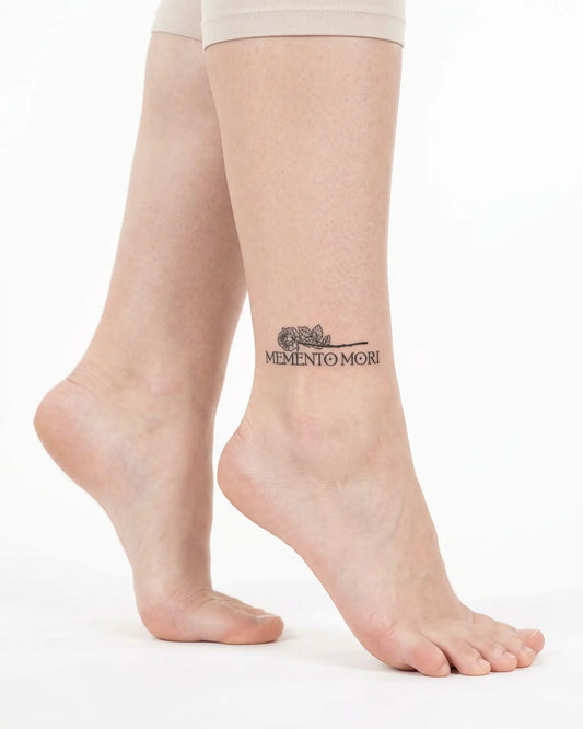 INKY Memento Mori semi-permanent tattoo applied on a woman – 2 x 2 in (4x4 cm) design, realistic ink look, lasts 10 days