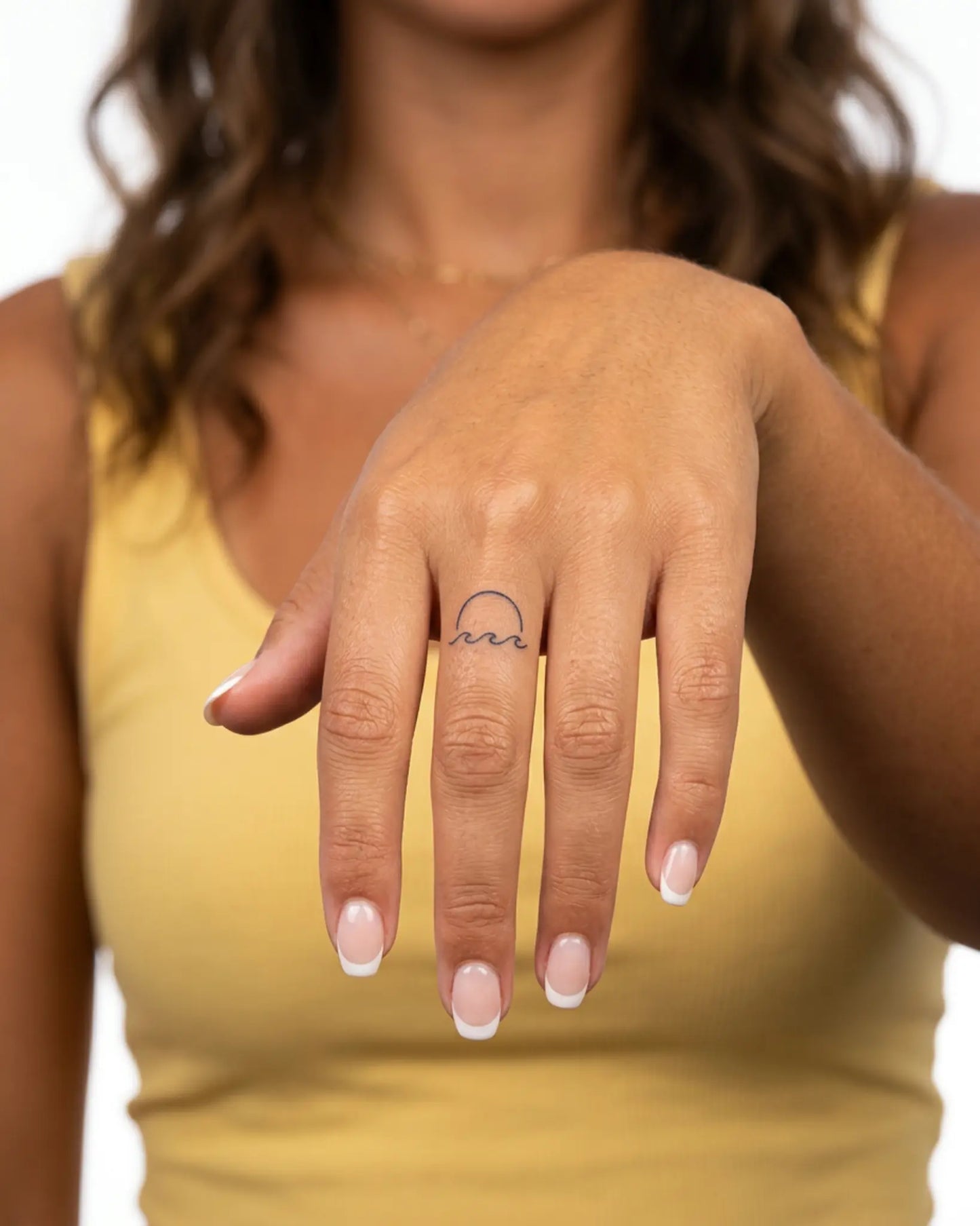 INKY Ocean Sun semi-permanent tattoo applied on a woman – 0.5 x 0.5 in (1x1 cm) design, realistic ink look, lasts 10 days
