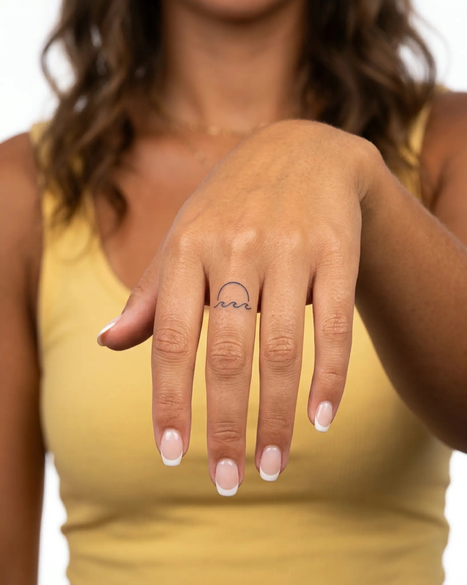 INKY Ocean Sun semi-permanent tattoo applied on a woman – 0.5 x 0.5 in (1x1 cm) design, realistic ink look, lasts 10 days
